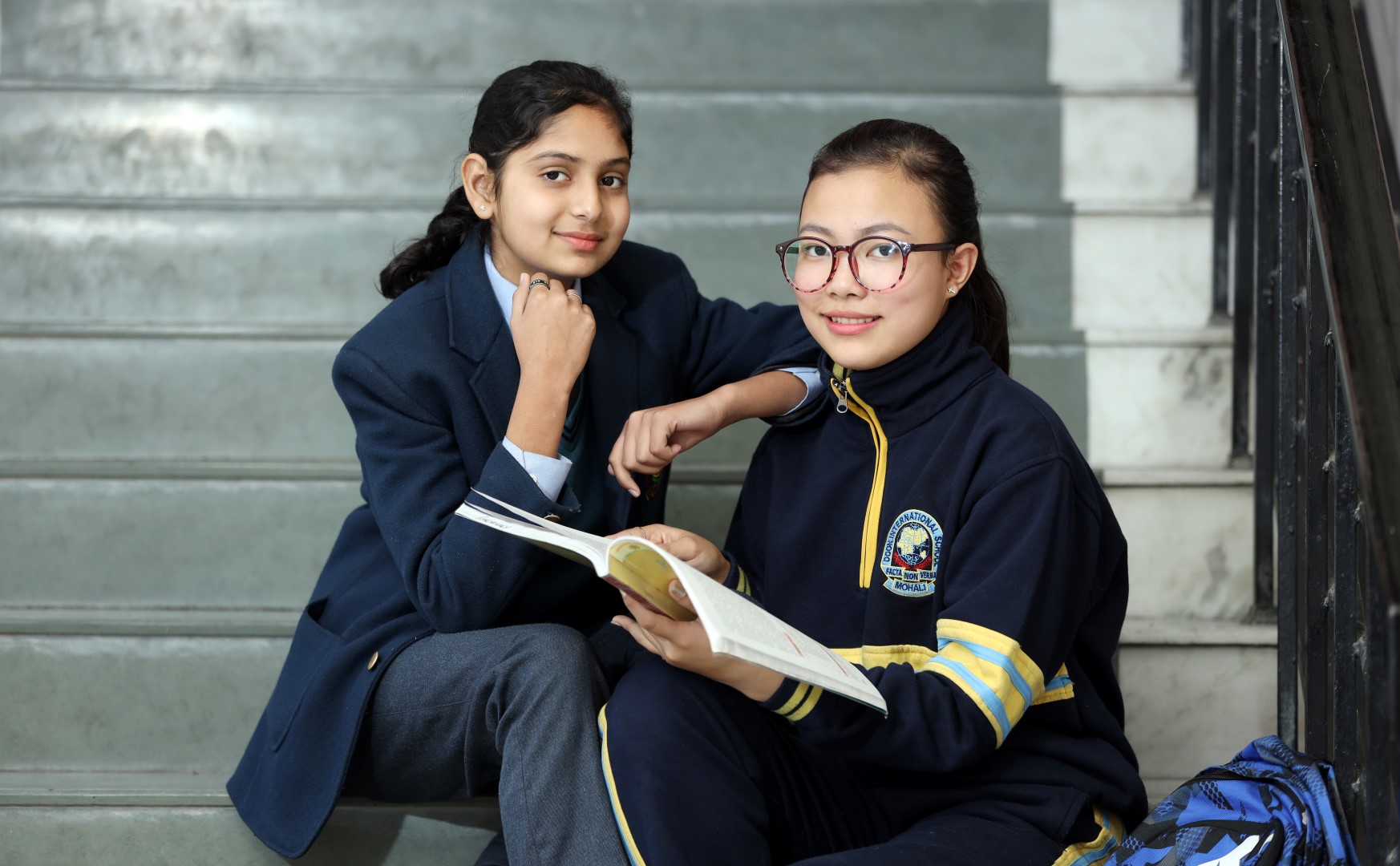 2 students talking and smiling
