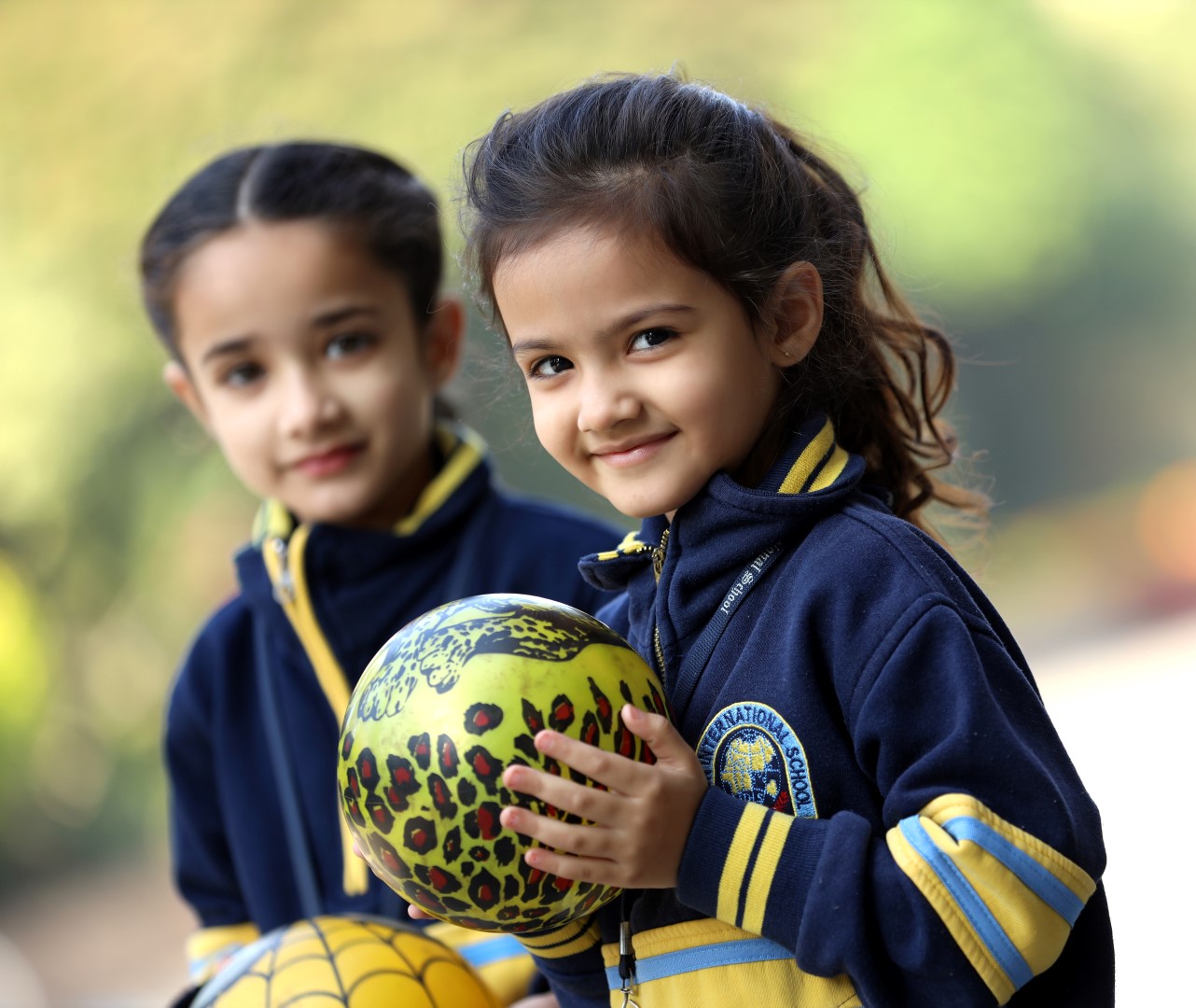 2 students talking and smiling