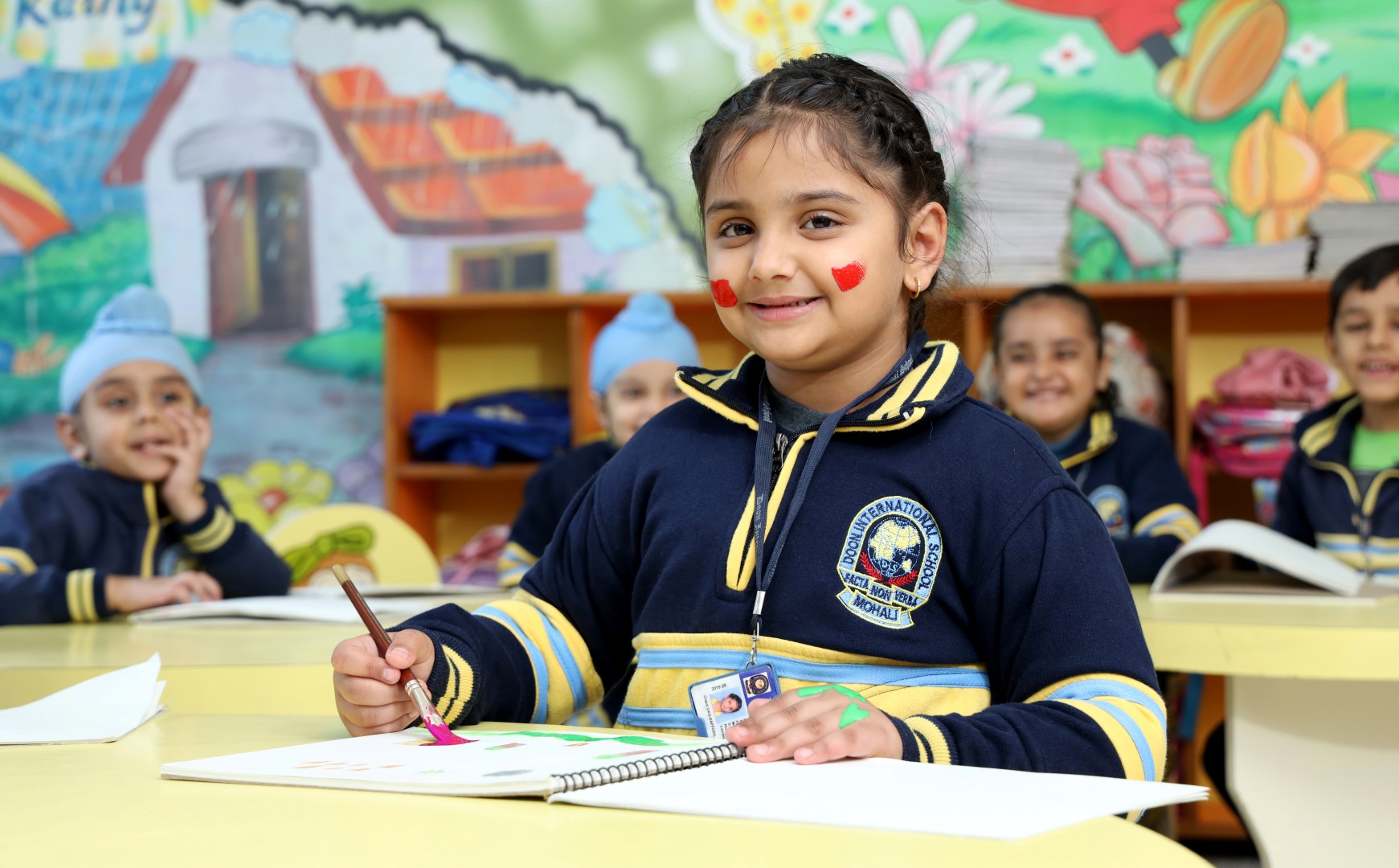 2 students talking and smiling