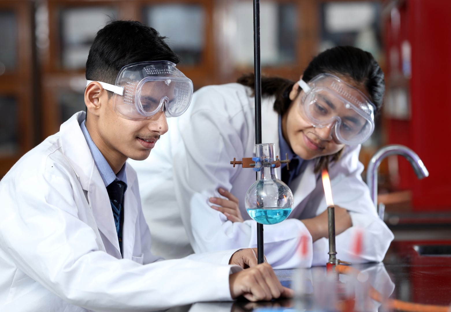 2 students talking and smiling