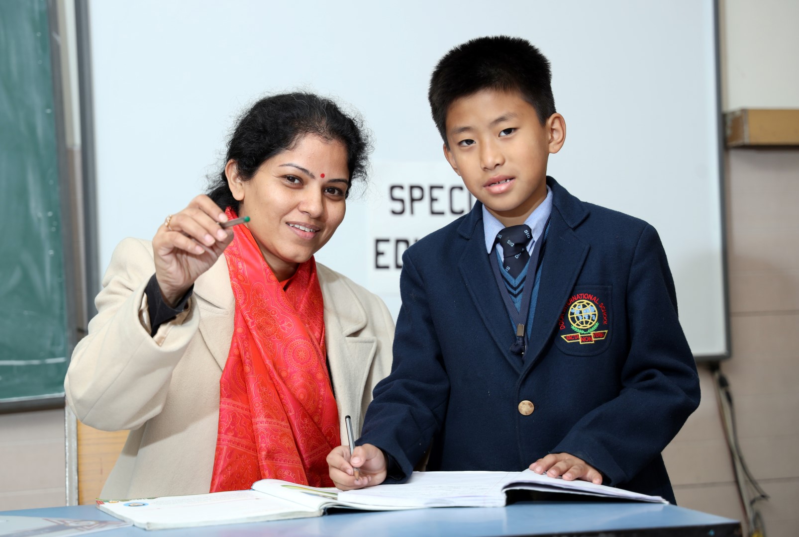 2 students talking and smiling
