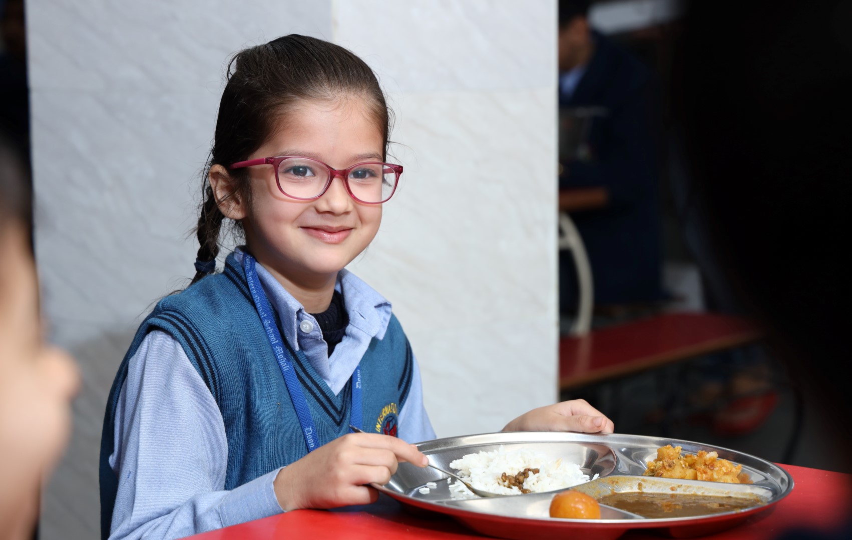 2 students talking and smiling