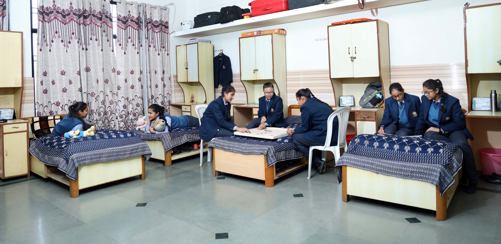 2 students talking and smiling