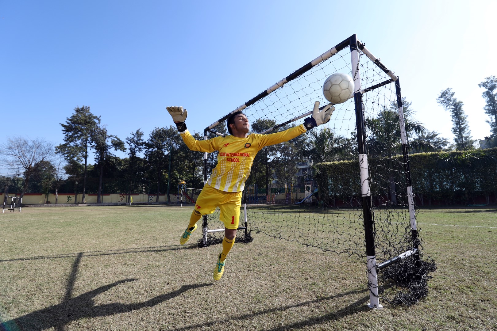 2 students talking and smiling