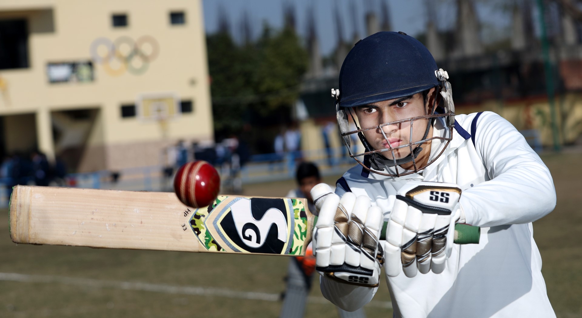 2 students talking and smiling